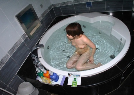 Japanese redhead Waka gets naked in a round bathtub during solo action 32154712