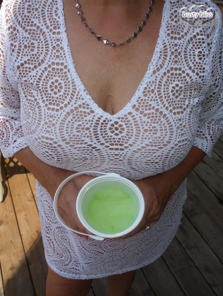 Mature woman Busty Bliss exposes her boobs while enjoying an alcoholic drink 67166835