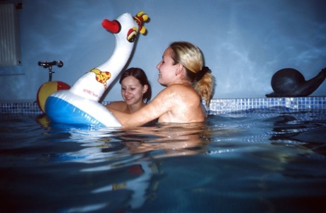 Sassy teenage cuties revealing their slippy curves by the pool 65911648